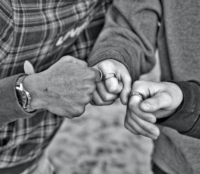 Three bumping fists